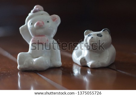 panda toys are white with brown background