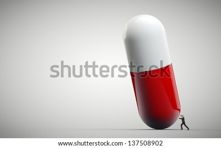 Man pushing huge medical pill