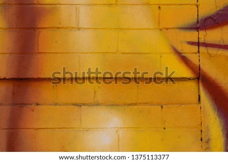 Vivid paint on closeup abstract brick texture background.