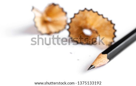 A pencil and a piece of a pencil on white paper background. Copy space for your text or image.