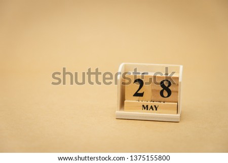 May 28 wooden calendar on vintage wood abstract background. using as background Universal day concept with copy space for your text or design.