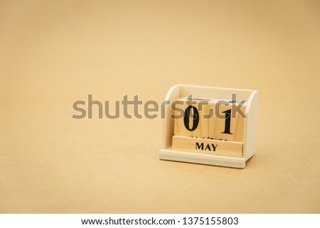 May 1 wooden calendar on vintage wood abstract background. using as background Universal day concept with copy space for your text or design.