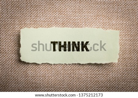 The word "Think" concept on paper background