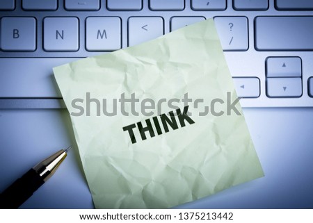The word "Think" concept on paper background