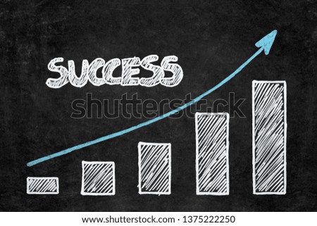 handwritten white chalk drawing graphs of success on blackboard with copy space. Planning concept