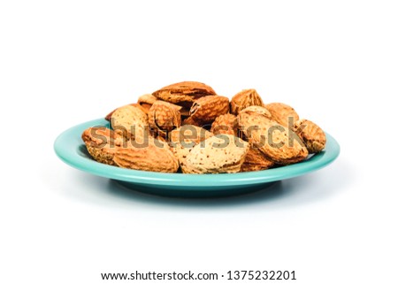 Dry Almonds nuts with shell on white background ,health food.