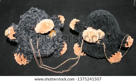 Two little plush chibi amigurumi platypus toys