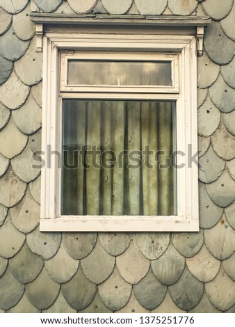 Windows at gray wall