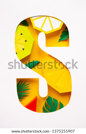 letter s cut from paper with tropical fruit paper