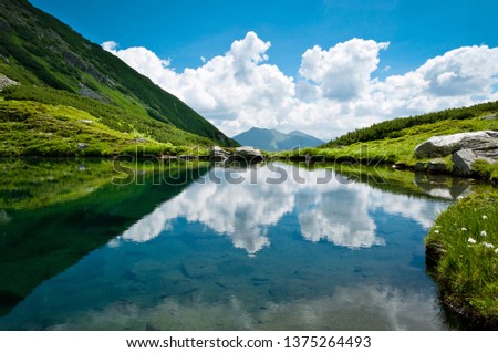 Buhaiescu Lake landscape in Romania, Rodnei Mountains Royalty-Free Stock Photo #1375264493