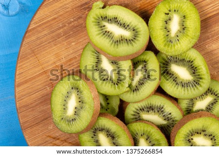 Kiwi Fruit On The Cutting Wooden Board.