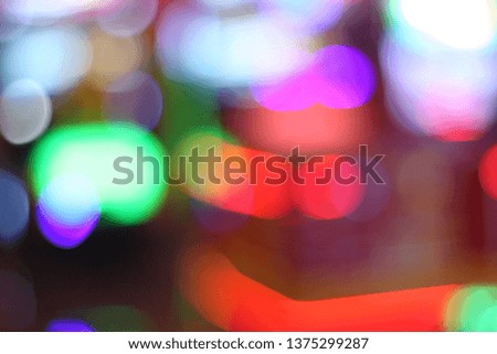 Beautiful bokeh light during festival celebration. Colorful random decorating light in city. Christmas and New Year moment.