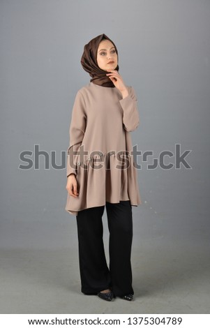 young women wearing hijab clothes on grey background studio