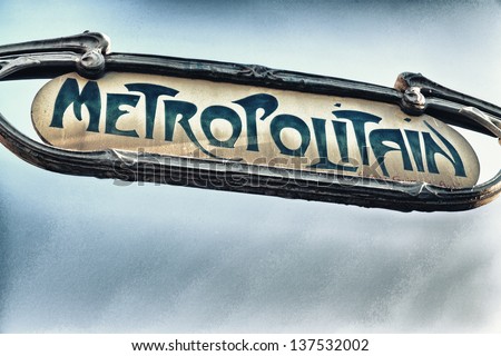 Famous historic Art Nouveau entrance sign for the Metropolitain underground railway system in Paris, France