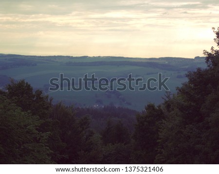 A picture of a landscape at sunset