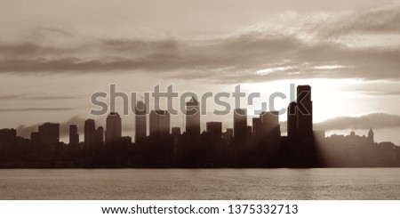 Seattle sunrise skyline silhouette view with urban office buildings. 