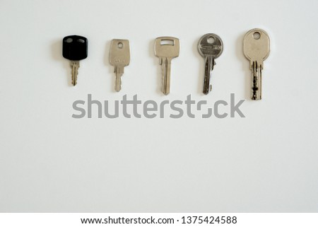 Metal keys on white background
