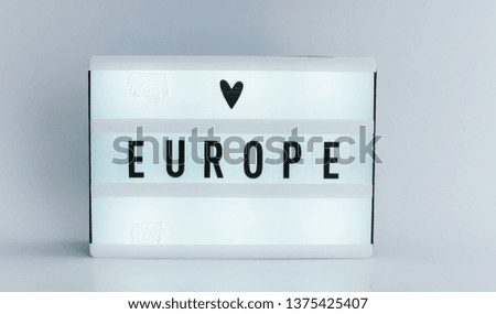 Photo of a light box with text, EUROPE, isolated white background 