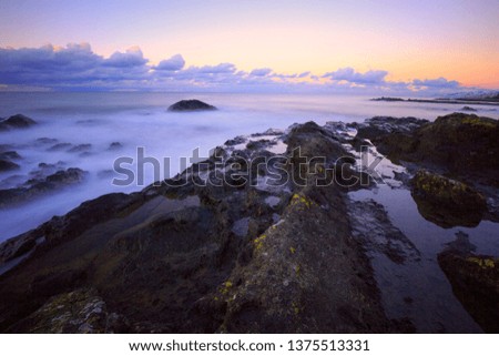 long exposure with cliffs and wave near sea