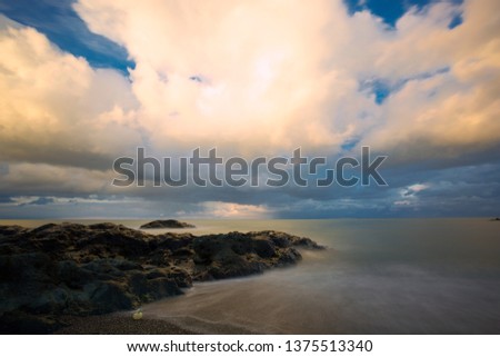 long exposure with cliffs and wave near sea