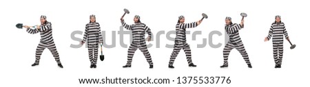 Prison inmate with spade isolated on white
