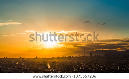 beautiful sunset of Tehran skyline, Tehran, capital of Iran cityscape at an amazing colorful sunset with blue sky and lovely clouds and Milad tower at the frame