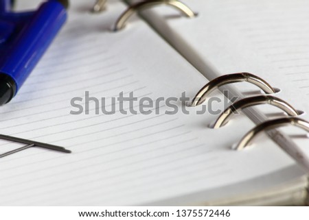 close up blank pages with lines of open notebook diary