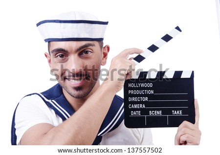 Sailor with movie clapper on white