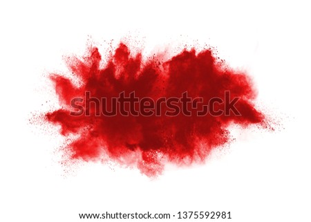 Red powder explosion on white background. Colored cloud. Colorful dust explode. Paint Holi. 