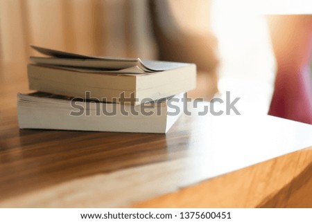 Stack books on wooden table