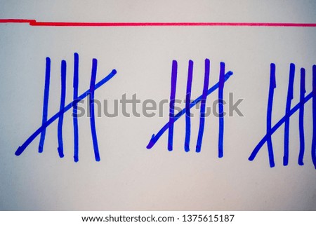 Blue tally marks like counting on the white board.