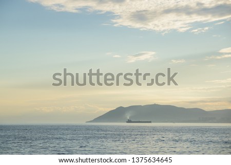 tanker at sunset seascape at Novorossiysk city, Black Sea coast bay, Russia stock photo image