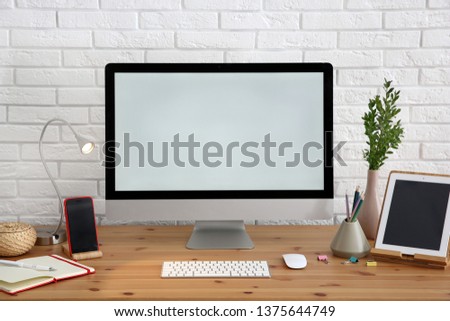 Stylish workplace with modern computer on desk