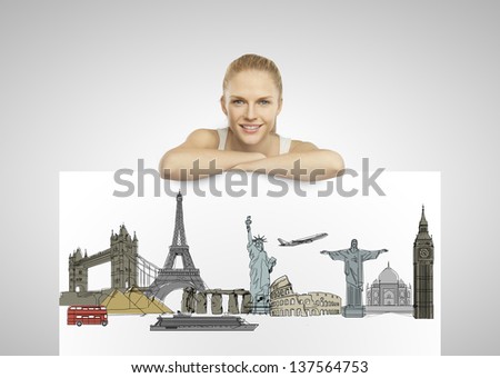 beautiful woman holding poster with traveling concept