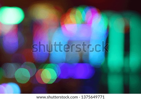 Beautiful bokeh light during festival celebration. Colorful random decorating light in city. Christmas and New Year moment.