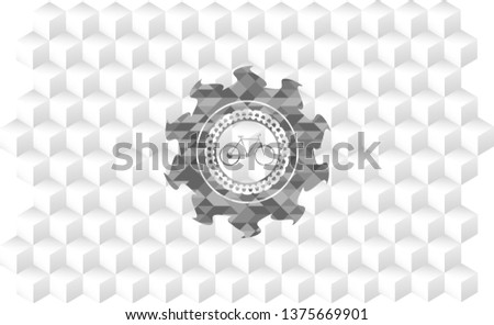 bike icon inside grey icon or emblem with geometric cube white background