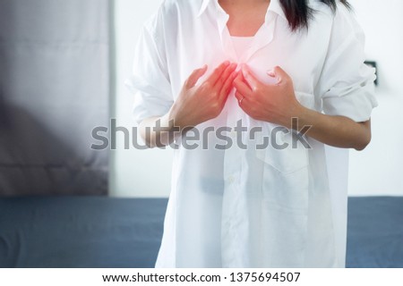 Asian woman having or symptomatic reflux acids,Gastroesophageal reflux disease,Because the esophageal sphincter that separates the esophagus and stomach dysfunction Royalty-Free Stock Photo #1375694507