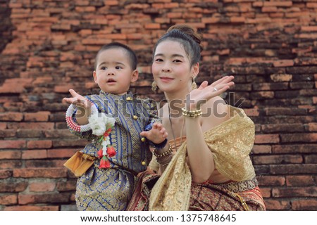Thai Woman and kid In Traditional Costume Of Thailand ,Ayuttaya Thailand,Thailand culture,Thai culture style ,Mom and little boy wear Thai culture style costume 