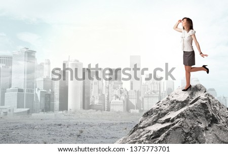 Young architect looking to ruined city from distance and thinking about investments