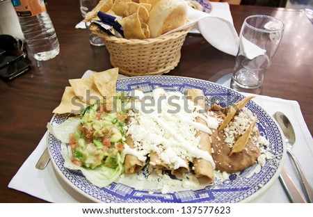 Enchiladas with cheese beans, and vegetables 