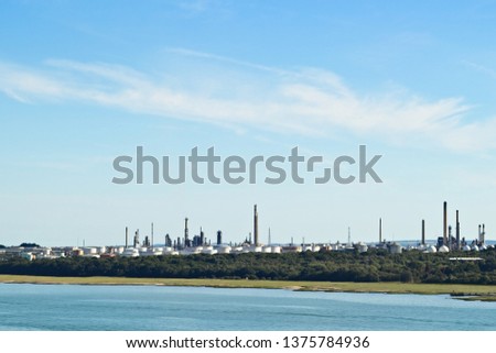 An industrial oil refinery plant near Southampton, England. Fossil fuel concept image. 