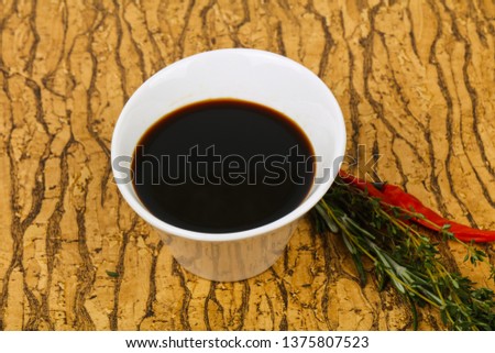 Soya sauce in the bowl served pepper