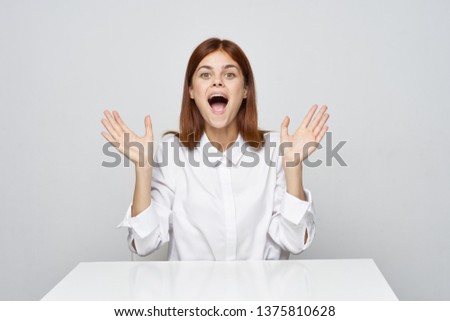 Red-haired woman white shirt emotions wide open mouth           