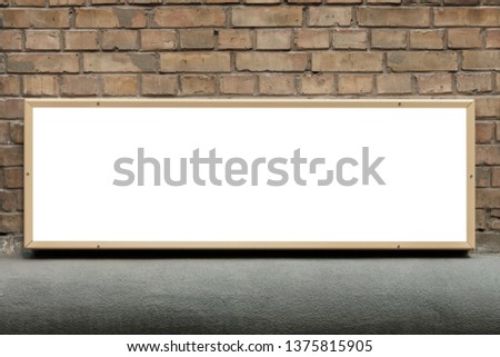 orizontal blank advertising board on the brick street wall. Large blank, empty, white billboard screen on yellow brick wall, billboard mock-up for concept idea 