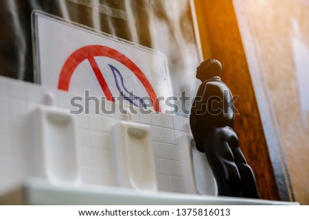 Restroom sign on a toilet door with no smoking sign,on wall background.Toilet sign - Restroom Concept -WC Model of Men take a leak WC signs for restroom.