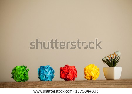Great idea concept. Crumpled colorful paper on wooden table. Copy space