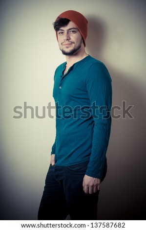 young modern stylish man on vignetting background