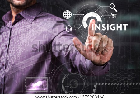 Business, Technology, Internet and network concept. Young businessman working on a virtual screen of the future and sees the inscription: Insight