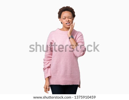 Beautiful young african american woman over isolated background touching mouth with hand with painful expression because of toothache or dental illness on teeth. Dentist concept.