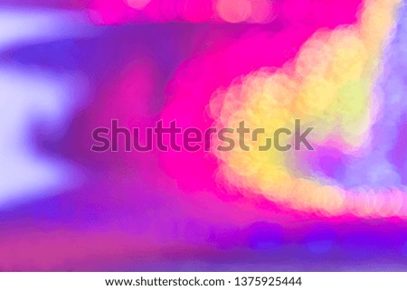 Multicolored abstract rainbow neon holographic bright background with gradient shining with bokeh effect of pink and blue